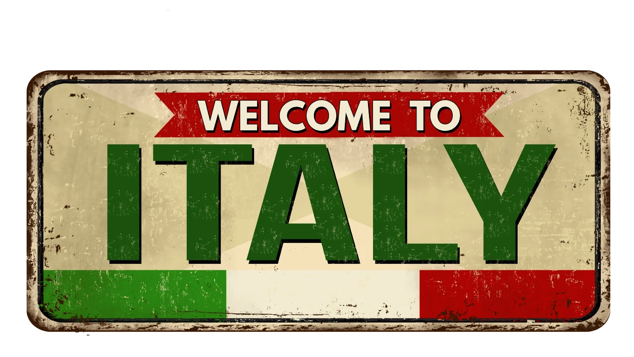 A vintage-style sign with the words “Welcome to ITALY,” featuring the green, white, and red colors of the Italian flag—a perfect greeting for new residents arriving in Italy.