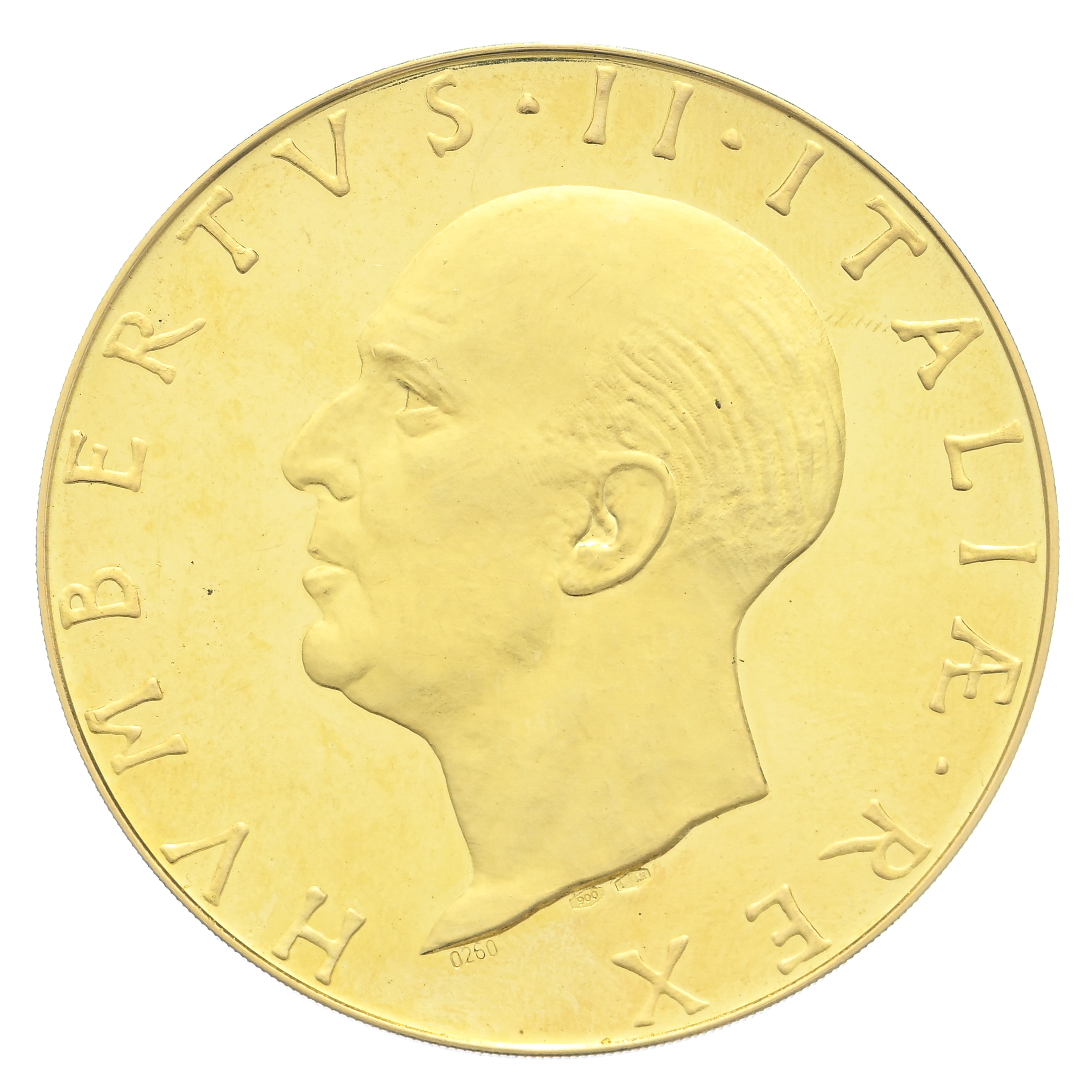 Moneta d'oro con il profilo di un uomo con i capelli corti rivolto verso sinistra. Il testo latino intorno al bordo recita "UMBERTO II RE D'ITALIA". Un classico esempio tra le medaglie sabaude da collezione.
